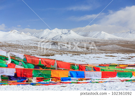 Tarcho and snowy mountains seen from the mountain pass on the way to Qomolangma Base Camp, Tibet Autonomous Region 102361092