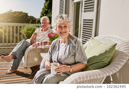 Happy, patio and portrait of senior couple with coffee enjoying bonding, quality time and relax in morning. Love, retirement and elderly man and woman smile with drink for breakfast outdoors at home 102362495