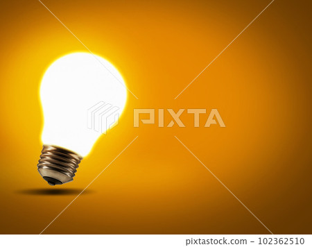 Energy, inspiration and lightbulb with a glow, innovation and science against studio background. Light, knowledge or enlightenment with ideas, growth and development with solution and problem solving 102362510