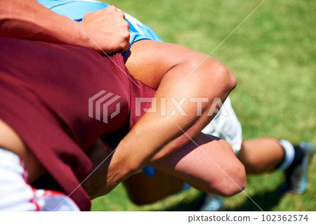 Rugby, scrum and men with fitness, closeup and match with energy, competition and training. Zoom, professional players or athletes with motion, motion or exercise with practice, tackle or performance 102362574