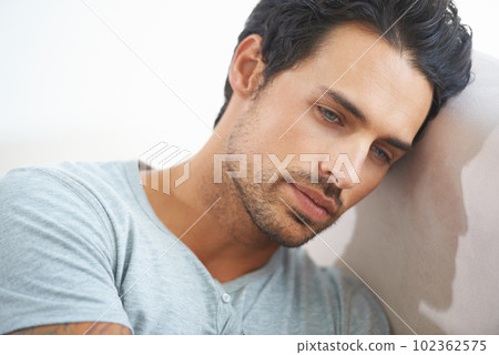 Face, male model and depression or sad, mindful and head on wall while isolated on studio white background. Mental health, stress and tired man thinking of problem or suffering in silence of failure Face, male model and depression or sad, mindful and head on wall while isolated on studio white background. Mental health, stress and tired man thinking of problem or suffering in silence of failure 102362575