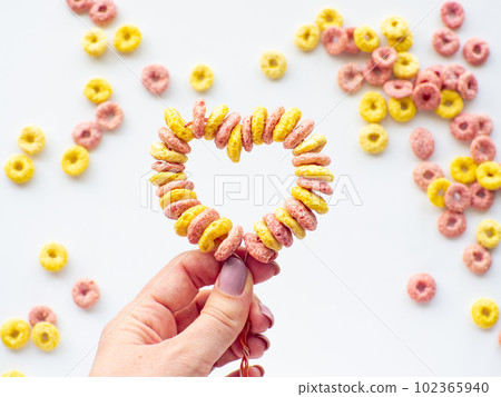 Cupcake toppers made with froot ring shaped cereal for Valentine's Day Cupcake toppers made with froot ring shaped cereal for Valentine's Day 102365940