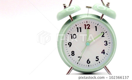Photo of a table clock with a white background Photo of a table clock with a white background 102366137