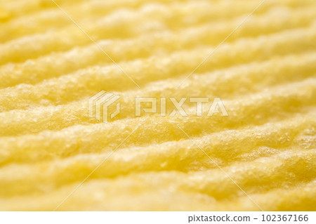 Potato chip texture background closeup Potato chip texture background closeup 102367166