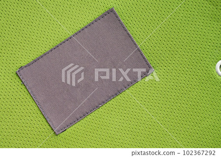 laundry care clothing label patch on polyester fabric jersey sport texture laundry care clothing label patch on polyester fabric jersey sport texture 102367292