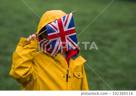 Little kid with UK flag. Education online language school for kids. Happy boy on Charles III coronation in 6 of May 2023, England, UK Little kid with UK flag. Education online language school for kids. Happy boy on Charles III coronation in 6 of May 2023, England, UK 102368518