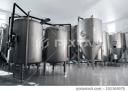 interior of modern factory brewery with tanks inside interior of modern factory brewery with tanks inside 102369070
