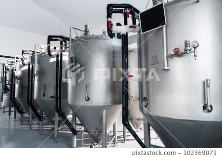 interior of modern brewery with beer fermentation tanks 102369071