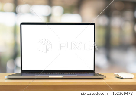 Laptop with blank screen on wood table with cafe coffee shop blur background Laptop with blank screen on wood table with cafe coffee shop blur background 102369478