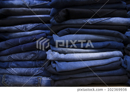 folded blue jeans pant pattern texture can be used as a background wallpaper 102369936