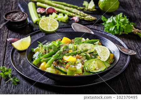 alkaline green soup in black bowl, top view alkaline green soup in black bowl, top view 102370495