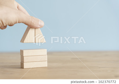 House business concept. House model on an empty background. Rent, construction, real estate idea 102370772