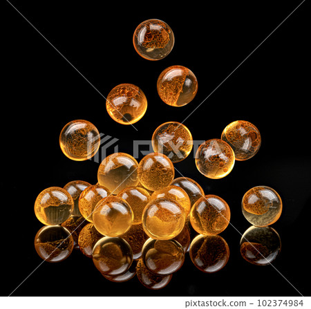 Falling red caviar isolated on black background 102374984