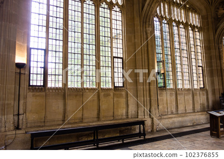A historic stone building seen through a lattice window, the city of Oxford 102376855