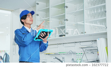 A worker checking the interior design on a tablet A worker checking the interior design on a tablet 102377722