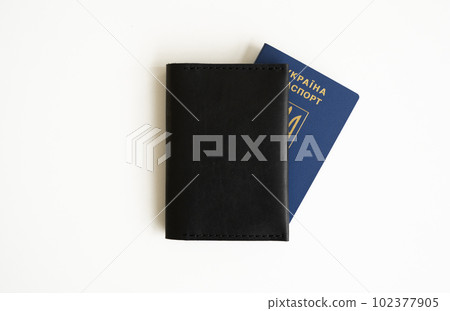 Ukrainian biometric passport id with a genuine leather cover on a white background. 102377905
