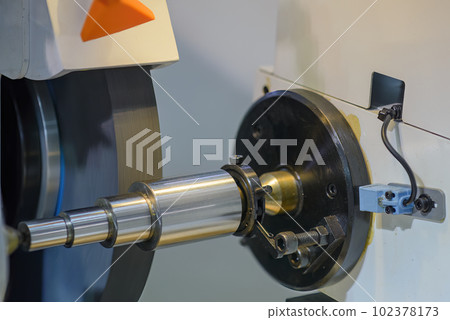 Close up scene the cylindrical grinding machine operation. Close up scene the cylindrical grinding machine operation. 102378173