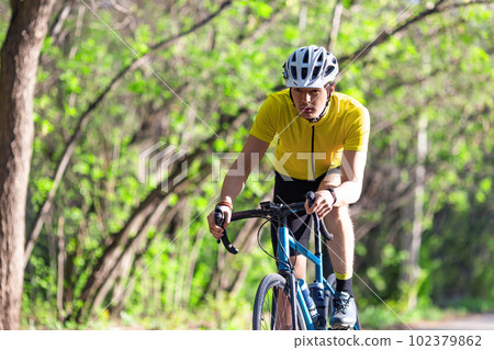 Young athlete during a bicycle race. Young athlete during a bicycle race. 102379862