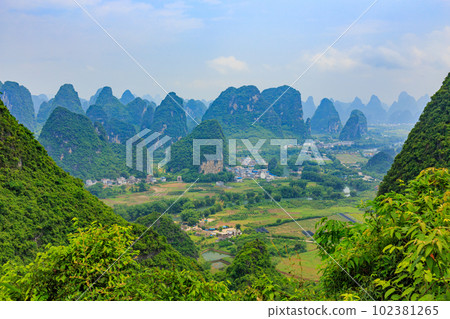 The scenery of the outskirts of Guilin, China, surrounded by strange peaks The scenery of the outskirts of Guilin, China, surrounded by strange peaks 102381265