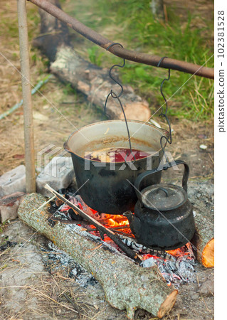 the Tourist pot over the camp fire 102381528