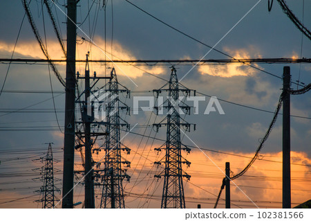 The yellow hazy sky and the silhouette of the building at sunset The yellow hazy sky and the silhouette of the building at sunset 102381566