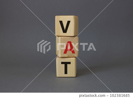 VAT - Value Added Tax symbol. Wooden cubes with word VAT. Beautiful grey background. Business and Value Added Tax concept. Copy space. VAT - Value Added Tax symbol. Wooden cubes with word VAT. Beautiful grey background. Business and Value Added Tax concept. Copy space. 102381685