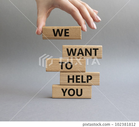 We want to help you symbol. Wooden blocks with words We want to help you. Beautiful grey background. Businessman hand. Business and We want to help you concept. Copy space. 102381812