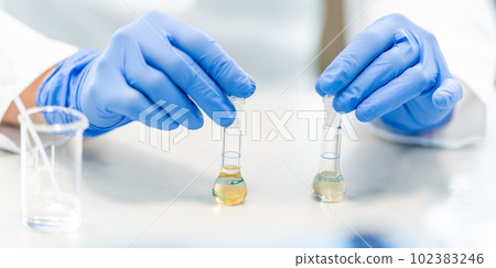 chemical substance in a glass test tube in a research laboratory. genetic test 102383246