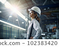 Female engineer worker in protective hat and glasses on manufacturing. AI Generative 102383420