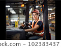 Portrait of smiling woman working with a forklift in a warehouse. Generative AI 102383437