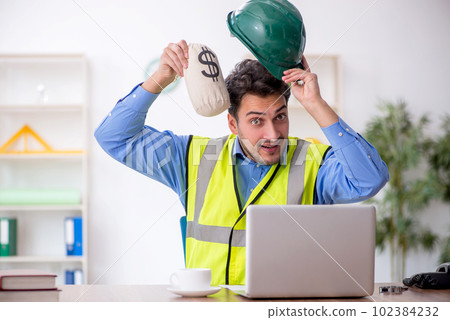 Young male architect in remuneration concept 102384232