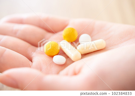 Hand of women with medicine 102384833