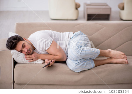 Young man starting day at home Young man starting day at home 102385364