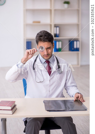 Young male doctor radiologist working in the clinic Young male doctor radiologist working in the clinic 102385621
