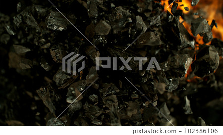 Burning coal with fire, top view shot. Burning coal with fire, top view shot. 102386106