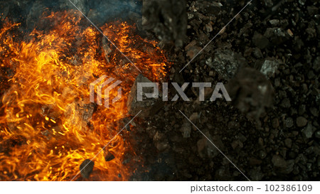 Burning coal with fire, top view shot. 102386109