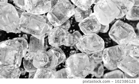 Freeze motion of flying ice cubes isolated on black background. Freeze motion of flying ice cubes isolated on black background. 102386128