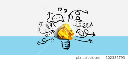 Brainstorming concept with a crumpled paper light bulb 102386793