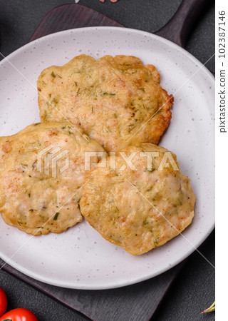 Delicious fried chopped fillet pancakes with spices, salt and herbs 102387146