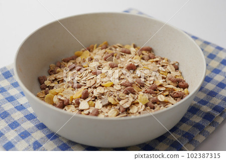 Home Made Musli in a bowl on black, 102387315