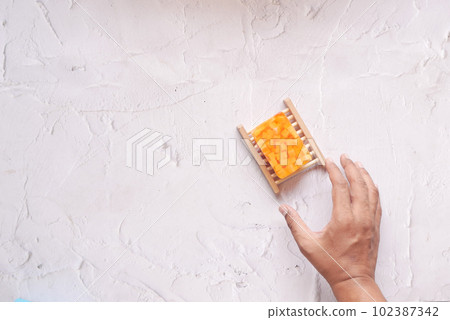 top view of hand pick natural soap bar on table  102387342