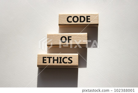 Code of ethics symbol. Concept words Code of ethics on wooden blocks. Beautiful white background. Business and Code of ethics concept. Copy space. 102388001