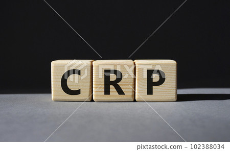 CRP - C-Reactive Protein Test symbol. Wooden cubes with word CRP. Beautiful grey background. Medical and C-Reactive Protein Test concept. Copy space. 102388034