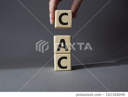 CAC - Customer Acquisition Cost symbol. Wooden cubes with word CAC. Beautiful grey background. Businessman hand. Business and Customer Acquisition Cost concept. Copy space. CAC - Customer Acquisition Cost symbol. Wooden cubes with word CAC. Beautiful grey background. Businessman hand. Business and Customer Acquisition Cost concept. Copy space. 102388046