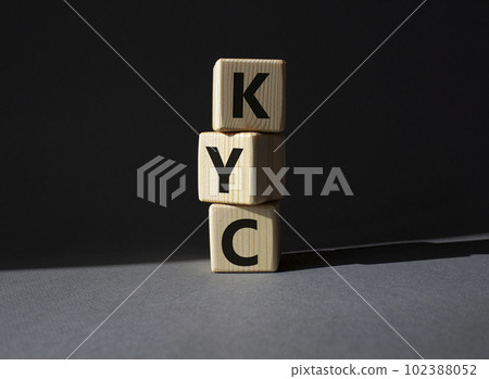 KYC - Know Your Customer. Wooden cubes with word KYC. Beautiful grey background. Business and Know Your Customer concept. Copy space. 102388052