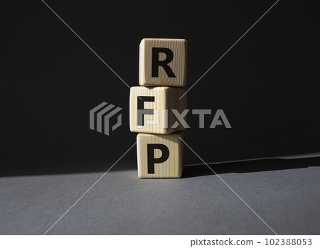 RFP - Request for Proposal. Wooden cubes with word RFP. Beautiful grey background. Business and Request for Proposal concept. Copy space. 102388053