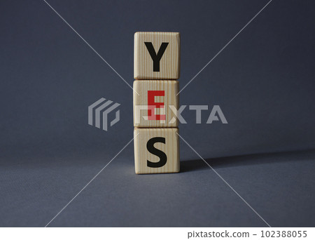 Yes symbol. Wooden blocks with word yes. Beautiful grey background. Business and yes concept. Copy space. 102388055