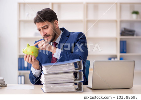 Young male employee in planning retirement concept Young male employee in planning retirement concept 102388695