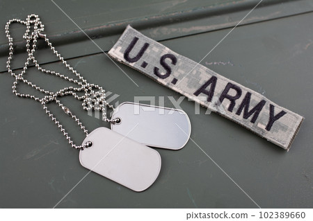 US ARMY branch tape and dog tag on green ammo can 102389660