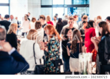 Blured image of businesspeople at coffee break at conference meeting. Business and entrepreneurship. Blured image of businesspeople at coffee break at conference meeting. Business and entrepreneurship. 102389723